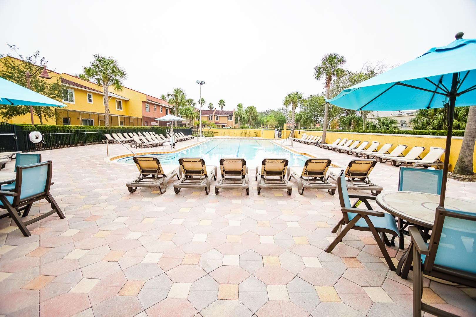A relaxing view of the outdoor swimming pool at VRI's Fantasy World Resort in Florida.